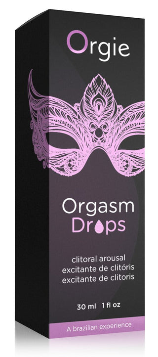 En 30 ml svart låda märkt Orgie - Orgasm Drops, med en rosa maskdesign och innehåller en lusthöjande olja för ökad njutning.