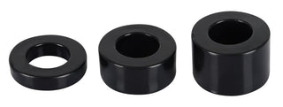 Penisring - Rebel MBS Ball Stretching Kit har tre svarta, cylindriska, ihåliga ringar av varierande höjd arrangerade i rad på en vit bakgrund, perfekt balanserar konsten att form och funktion.
