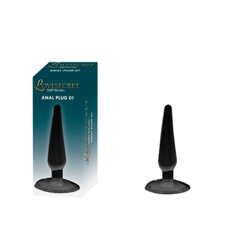 En svart analplugg tillverkad av kroppssäkert TPE sitter bredvid sin förpackning märkt Analplug 01 Sugpropp 11 cm på en vit bakgrund - perfekt för nybörjare.