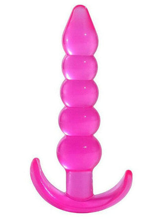 T-Plug 04 Buttplug 12 cm är en rosa, pärlformad plug med en spetsig spets och ett böjt bashandtag, tillverkad av slätt TPE-material.