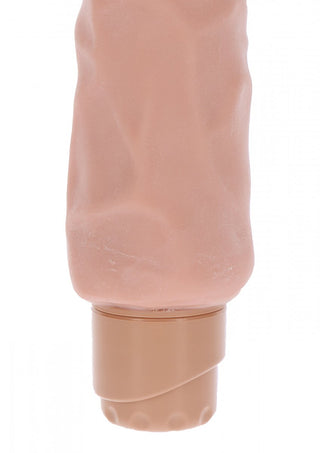 Naturskön Vibratordildo 23 cm är ett räfflat, hudtonat silikonrör tillverkat av TPE-material, med ett skruvlock i botten.