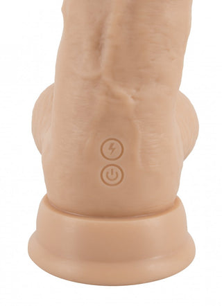 Realistixxx Torero Dildo, ett köttfärgat föremål med kraft- och blixtsymboler, står självsäkert på sin runda bas. Förbättrad av flera vibrationslägen kombinerar den funktionalitet och elegans.