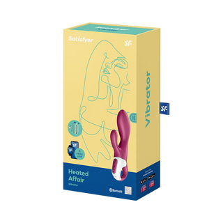 Gul och blå Satisfyer Heated Affair-ask med produktillustration; har en silikondesign och värmefunktion.