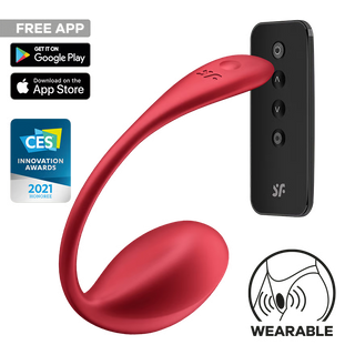 Bärbar vibrator i röd silikon med böjd design, trådlös fjärrkontroll och appstyrning, mot en enfärgad bakgrund.