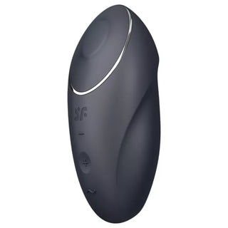 Svart handhållen vibrator med ergonomisk design, cirkulär topp, kontrollknappar och slätt material.