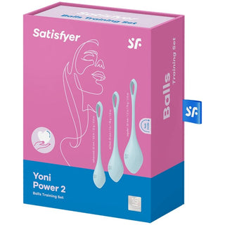 Satisfyer Yoni Power Knipkulor har elegant rosa och blå förpackning med abstrakt ansiktslinjekonst, perfekt för att förstärka din bäckenbottenmuskulatur.