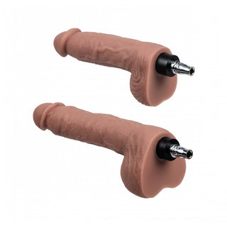 Två kranhandtag som liknar realistiska manliga könsorgan på vit bakgrund, som påminner om design från Lovense Sexmaskin, suddar ut gränserna mellan konst och distanssexinnovation.