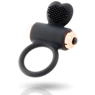 Zues - Vibrerande Penisring är en svart ring gjord av premium silikon, med en texturerad hjärtformad spets med eleganta guldaccenter.