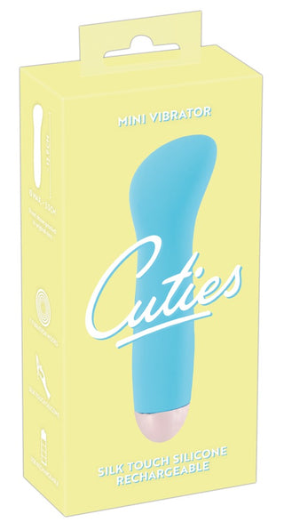 Gul låda som innehåller Cuties Mini vibrator 13 cm, med 7 vibrationslägen, USB-laddningsbarhet och en vattentät design.