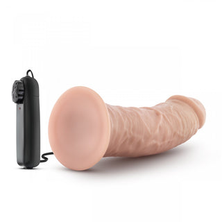 Dr Skin 19 cm Vibratordildo har en sugkopp och en trådbunden fjärrkontroll, utställd på en vit bakgrund.