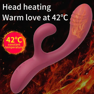 Rosa silikonvibrator med dubbel stimulering och uppvärmt huvud, med en böjd design och kaninformad yttre stimulator.