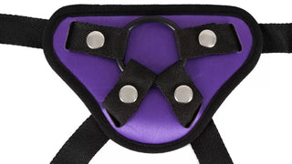 Universal Strap-on från You2Toys är en slående lila och svart sele med metalldubbar och en central O-ring, perfekt för äventyrligt strap-on-spel.